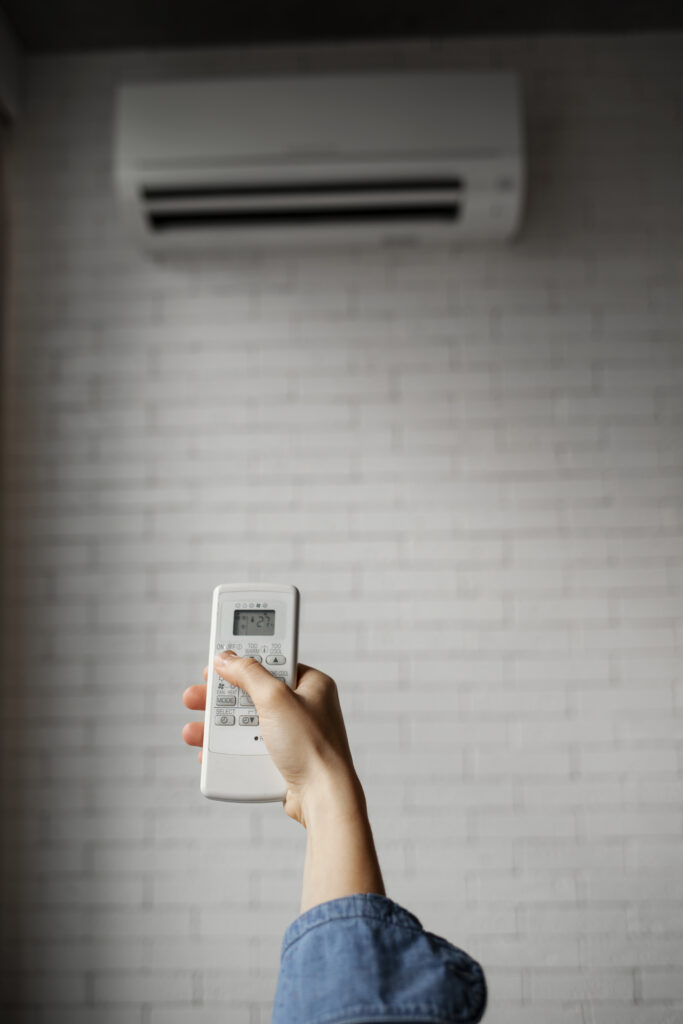 young woman using Air Conditioner