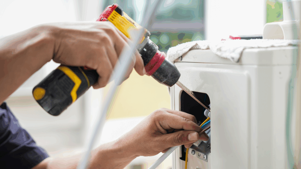 A technician uses a power tool to install a new furnace.